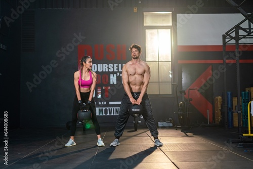 White Man and Asian Woman Unite in Fitness, Lifting Dumbbells - Strength, Teamwork, Unity. Diverse Duo.