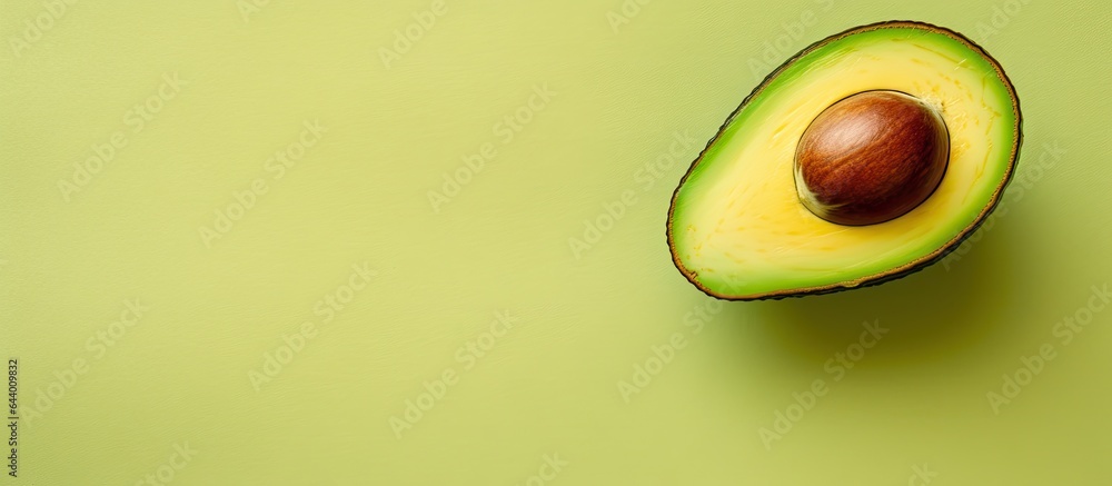 Avocado half on a isolated pastel background Copy space Avocado half on a isolated pastel background Copy space