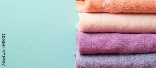 Colorful towels against isolated pastel background Copy space