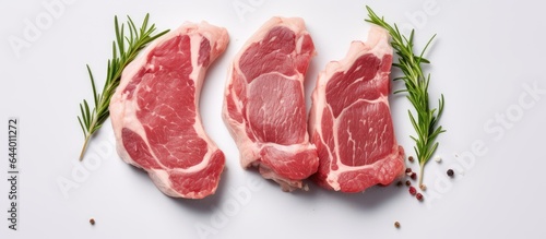 Fresh lamb or mutton cutlets in vacuum packaging photographed on a isolated pastel background Copy space