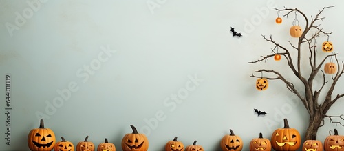 Halloween pumpkin baskets with a tree jack olantern on a isolated pastel background Copy space photo
