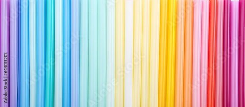 Assorted plastic straws in various colors isolated pastel background Copy space