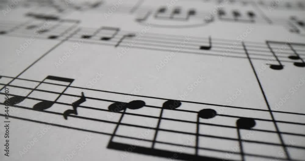 Musical notes printed on sheet of paper closeup. Musical literacy Musical notes printed on sheet of paper closeup. Musical literacy