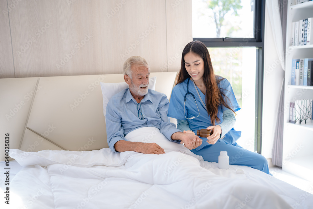 Nurse or doctor give man support during recovery, Caregiver holding hand of senior male patient, showing kindness while doing a checkup at a retirement health insurance, old age at home or hospital Nurse or doctor give man support during recovery, Caregiver holding hand of senior male patient, showing kindness while doing a checkup at a retirement health insurance, old age at home or hospital