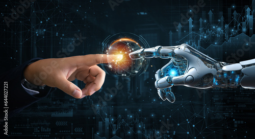 Obraz na płótnie Hands of robot and human touching on big data connection on stock graph background. Science and artificial intelligence technology, innovation of futuristic. AI, Machine learning. w salonie