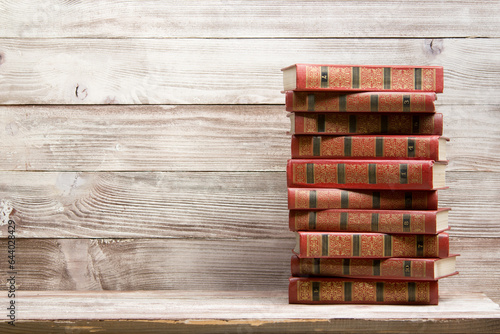 Open book, hardback books on wooden table. Back to school. Copy space	