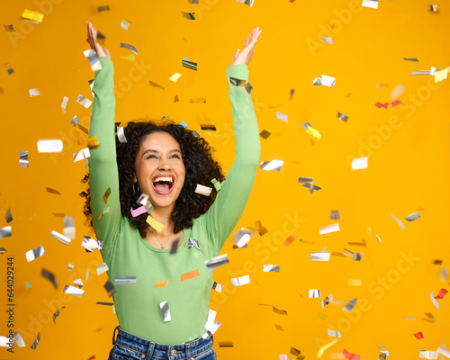 Cuadro en lienzo Studio Shot Of Excited Woman Celebrating Big Win Showered In Tinsel Confetti On