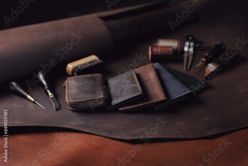 Top view tailor products make from skin. Case, purse made of natural leather brown color with tools