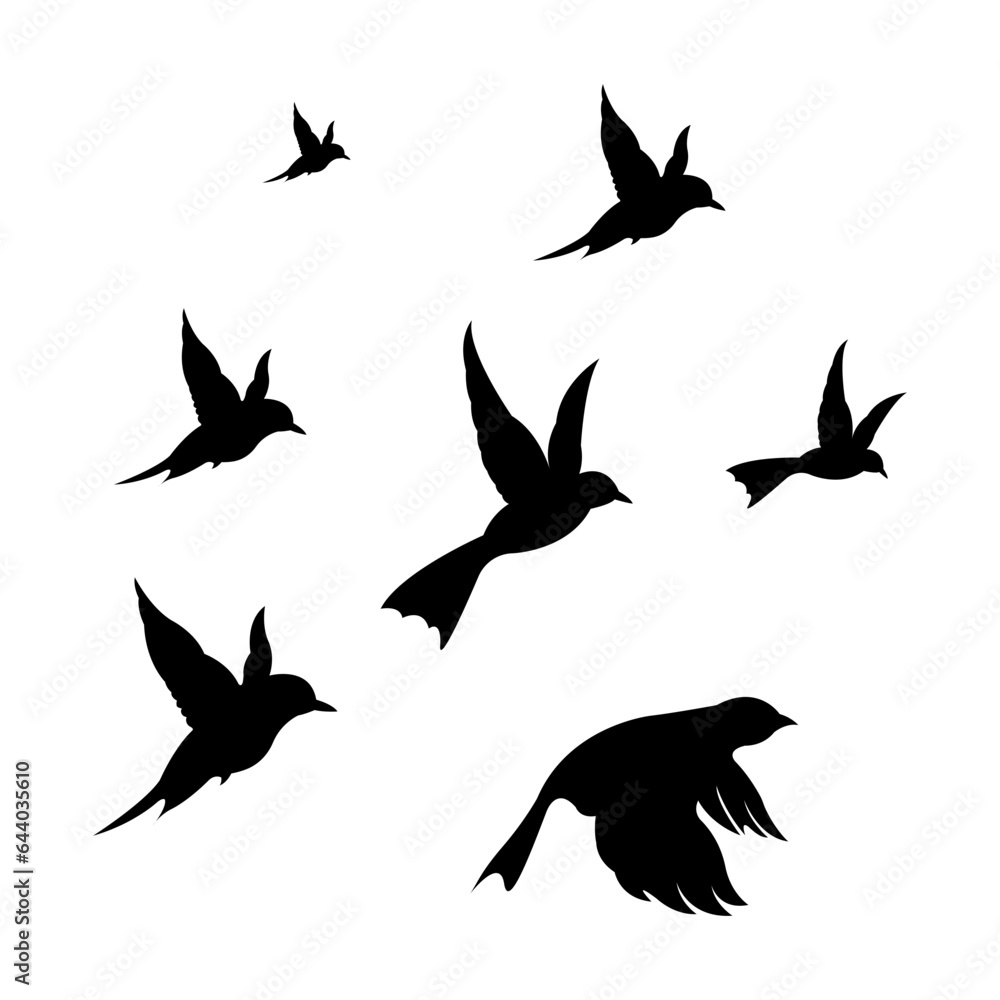 Fototapeta premium silhouettes of flock birds fly in sky