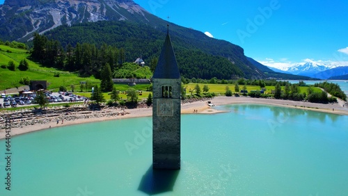 Church tower in Lake Reschen - Graun Vinschgau South Tyrol - a beautiful aerial view of the church tower in the lake