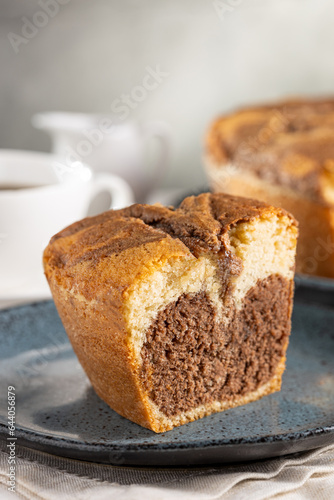 Marble cake and cup of coffee on the table.