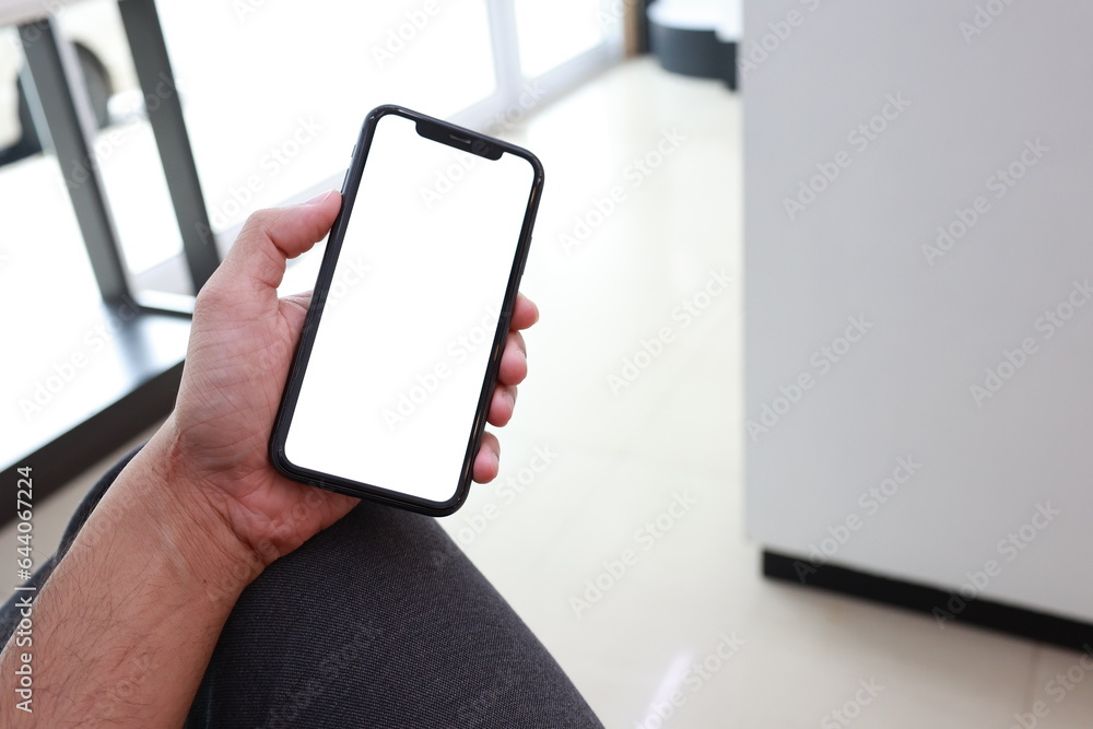hand holding smartphone with blank screen hand holding smartphone with blank screen
