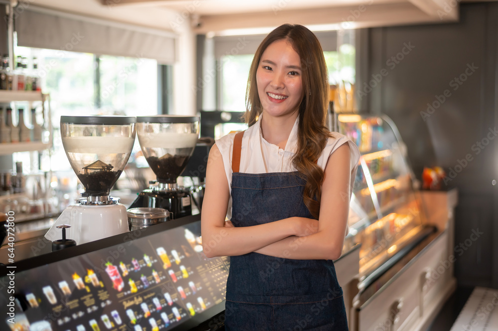 An Asian woman entrepreneur or barista working in modern coffee shop , concept small business An Asian woman entrepreneur or barista working in modern coffee shop , concept small business