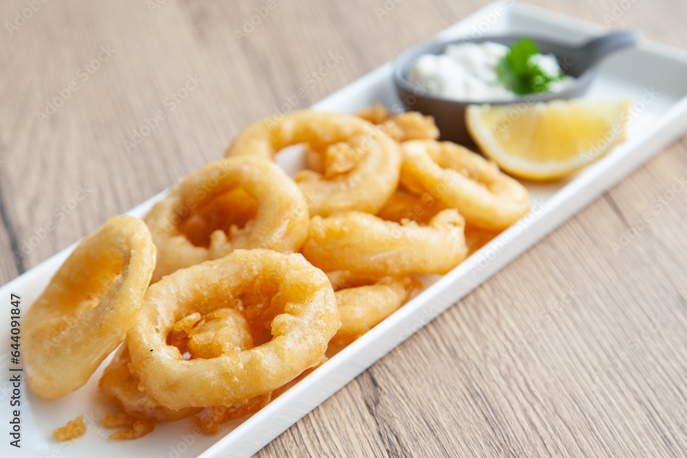 Crispy fried squid, Calamari with tartar sauce and lemon Crispy fried squid, Calamari with tartar sauce and lemon
