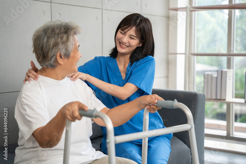 Nurse taking care of senior woman to physical therapy at hospital. Healthcare, Retirement, Volunteer, Caregiver and Lifestyle concept.
