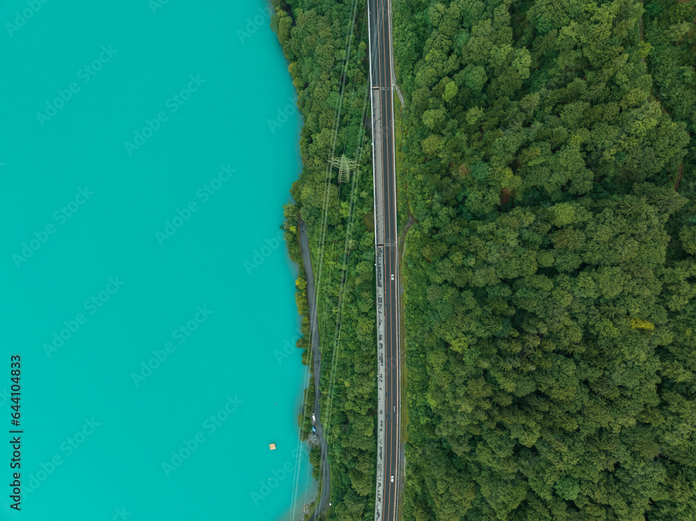 Aerial view of a road following the Brienzersee Lake coastline, Bonigen, Bern, Switzerland. Aerial view of a road following the Brienzersee Lake coastline, Bonigen, Bern, Switzerland.