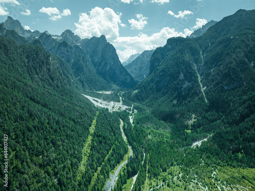 Aerial view of a road across the valley at Tre Cime Natural Park on the Dolomites mountain range, Toblach, Trentino, South Tyrol, Italy. photo