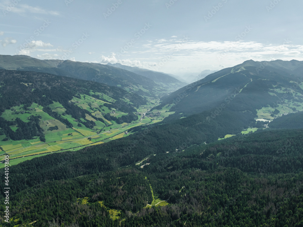 Aerial view of Versciaco town as seen from Croda dei Baranci (Birkenkofel) mountain peak on the Dolomites range, Trentino, South Tyrol, Italy. Aerial view of Versciaco town as seen from Croda dei Baranci (Birkenkofel) mountain peak on the Dolomites range, Trentino, South Tyrol, Italy.
