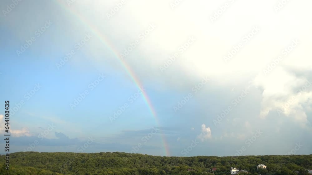 Rainbow in the sky after the rain over the forest. Rainbow in the sky after the rain over the forest.