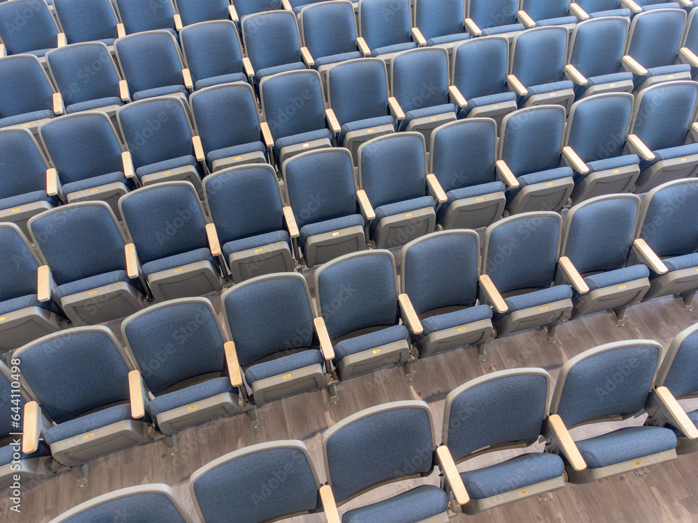 Overhead view of empty gray and blue theater, auditorium seats, chairs. Overhead view of empty gray and blue theater, auditorium seats, chairs.