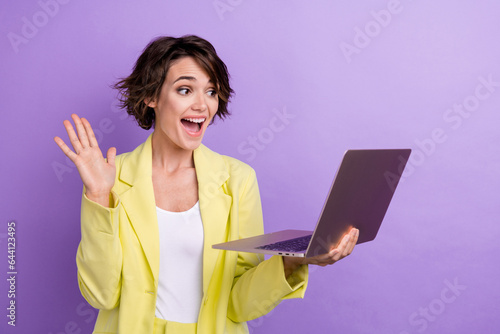 Photo of funny woman manager entrepreneur waving palm greetings laptop welcome colleagues meeting isolated on violet color background