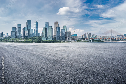 Empty asphalt road and city buildings skyline in Chongqing, China