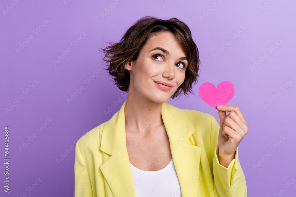 Photo of dream nice charming fashionista lady wear lime suit hold pink postcard heart look mockup sale isolated on purple color background Photo of dream nice charming fashionista lady wear lime suit hold pink postcard heart look mockup sale isolated on purple color background