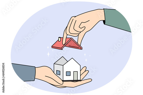 Huge hands building tiny house, set roof on building. Concept of construction. Real estate and rental. Vector illustration.