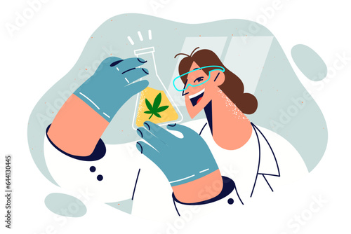 Woman holds flask of cannabis oil and smiles, conducting laboratory research on medical properties