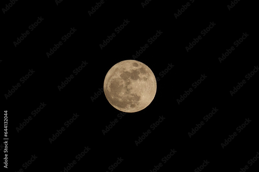 Yellow big full moon with black background Yellow big full moon with black background