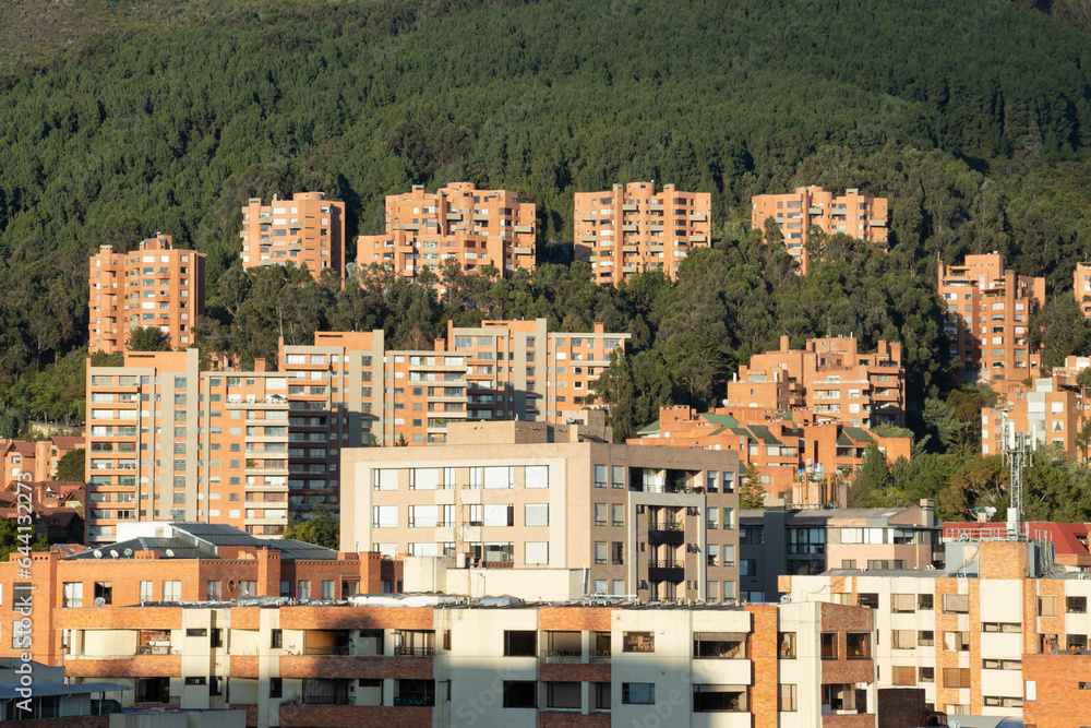 Residential brick luxury buildings located on eastern mountains in bogota colombia in sunset golden hour