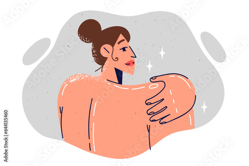 Naked woman stands with back to screen and touches shoulder, calling for skin care