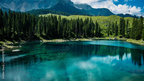 Glimpse of the stupendous Lake Carezza immersed in the Dolomites in Trentino Italy