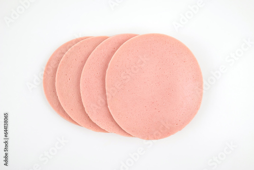 Sliced boiled tasty sausage isolated on white