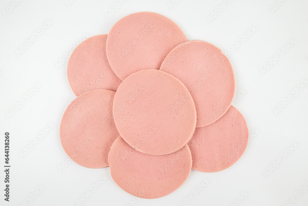Sliced boiled tasty sausage isolated on white Sliced boiled tasty sausage isolated on white