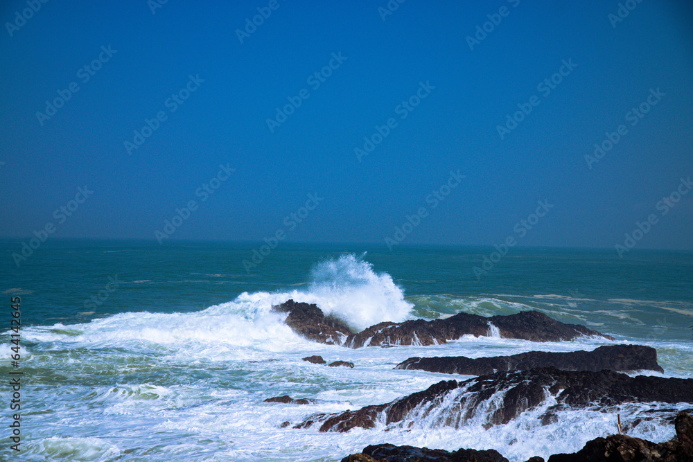 Panoramic view of rocky coastline hits by the wave. Menganti Beach, Indonesia