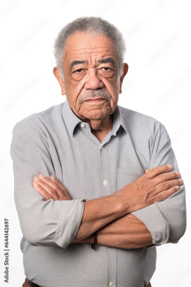 mixed race senior man with his arms crossed in front of a white background mixed race senior man with his arms crossed in front of a white background