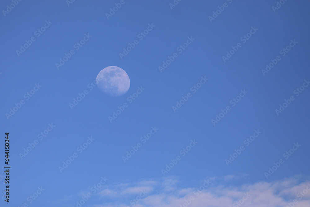 white moon on the blue sky in daytime white moon on the blue sky in daytime