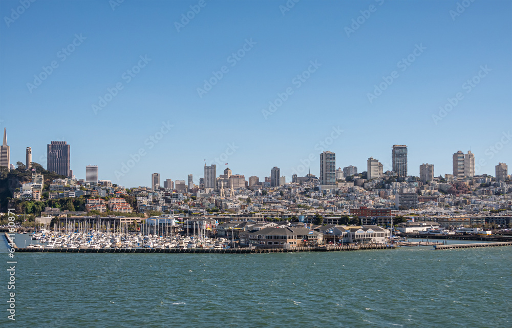 San Francisco, CA, USA - July 13, 2023: Panorama from Financial district and Coit tower all the way west over downtown with in front Yacht harbor and Pier 39. Blue sky