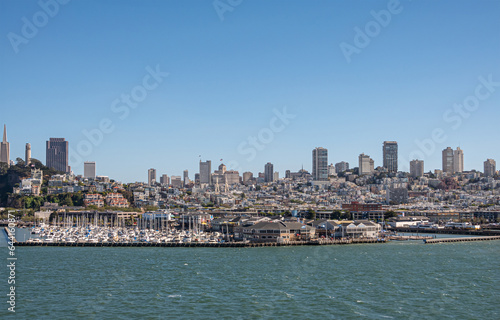 San Francisco, CA, USA - July 13, 2023: Panorama from Financial district and Coit tower all the way west over downtown with in front Yacht harbor and Pier 39. Blue sky © Klodien