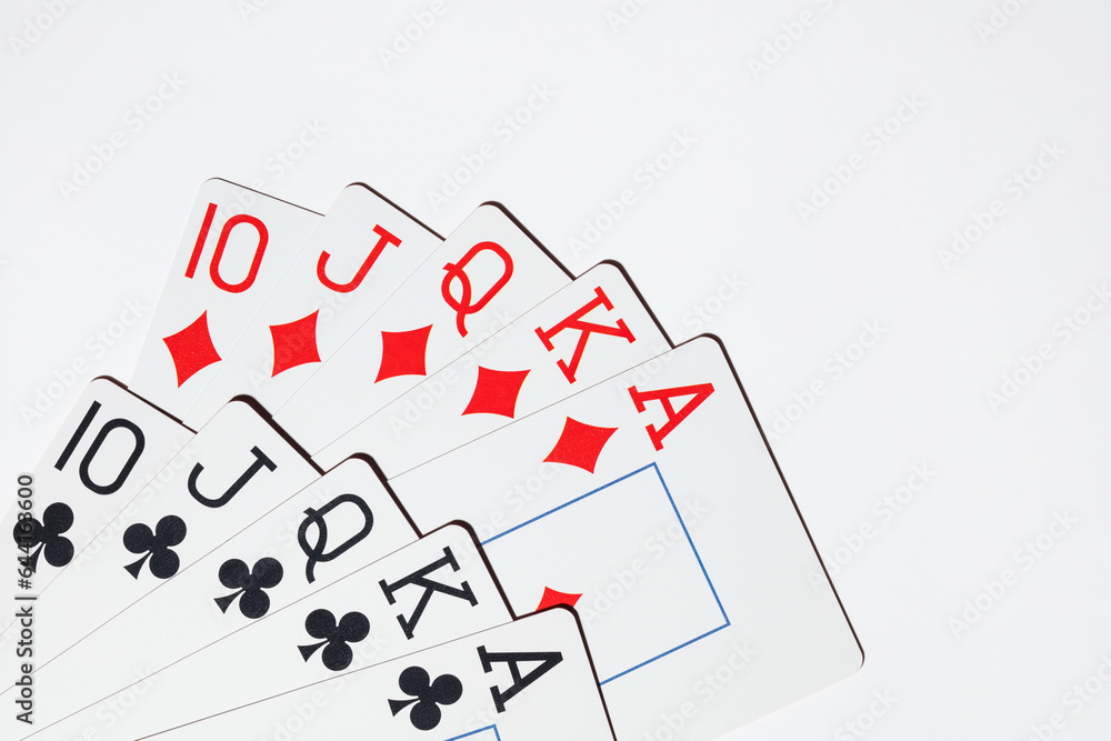 Playing cards on a white background. Top view. Royal flush hand of cards. Playing cards poker casino. Playing cards on a white background. Top view. Royal flush hand of cards. Playing cards poker casino.