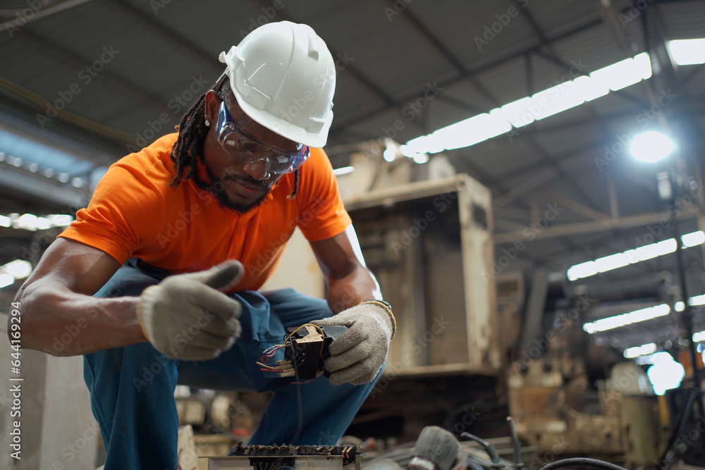 Professional electric engineer or repairman inspecting a broken ...