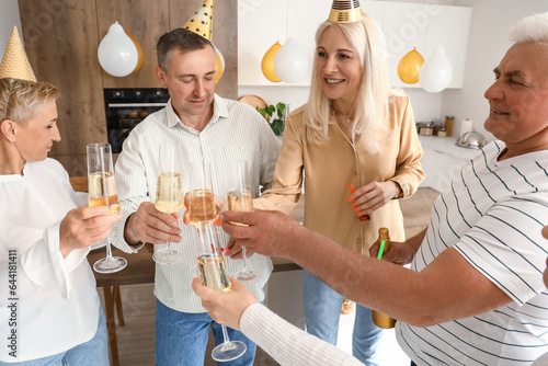 Mature people drinking cham...