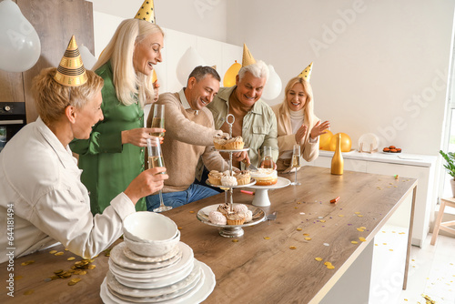 Mature man cutting Birthday...