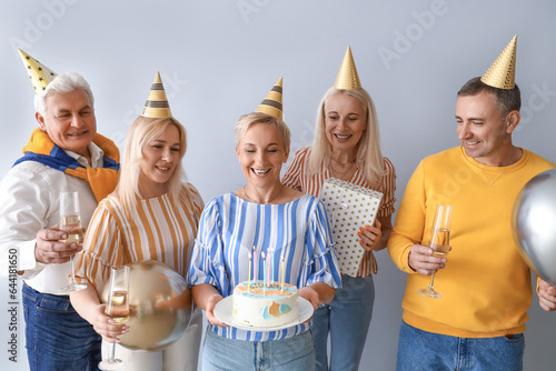 Happy adult friends celebra...