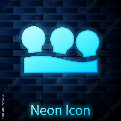 Glowing neon Vacuum cans icon isolated on brick wall background. Massage jars for face and body. Medical anticellulite cups. Vector