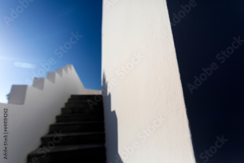 An abstract photograph of a wall and staircase.