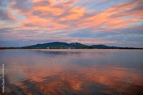 Stunning afterglows following sunset above the lake and Palava hills at South Moravia, Czech republic