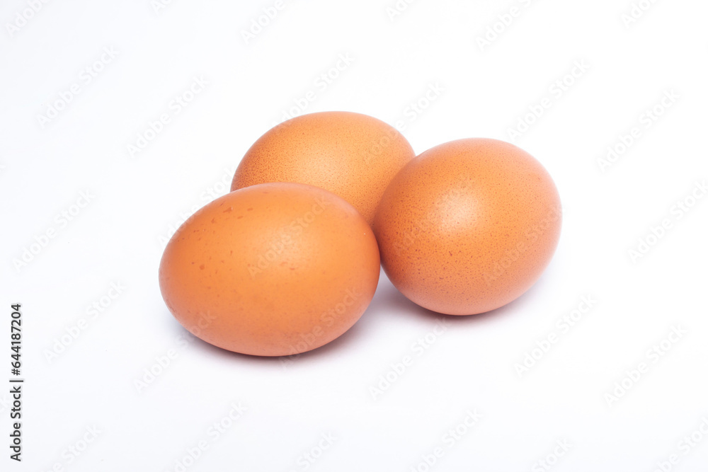 many chicken eggs isolated on a white background many chicken eggs isolated on a white background