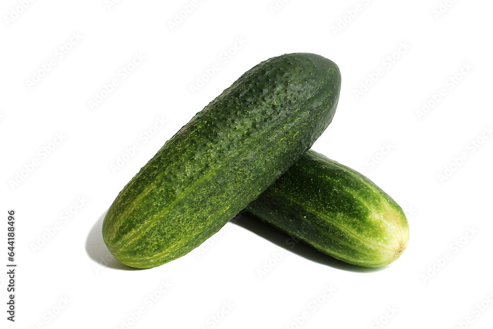 Two fresh green cucumbers lie on a white background. Two fresh green cucumbers lie on a white background.